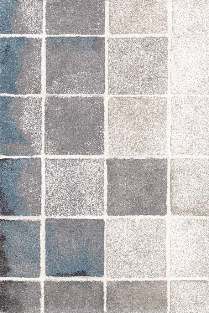 Sintelon tepih Vegas Home 71KWS Sintelon tepih Vegas Home 71 KWS – kvadratni dezen u sivim, bež, bijelim i plavim tonovima.