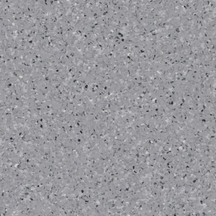 Antistatički pod iQ Toro SC Dark Grey 0102 u svijetlosivom granuliranom dezenu sa diskretnim crnim, tamnosivim i bijelim detaljima za profesionalne prostore.